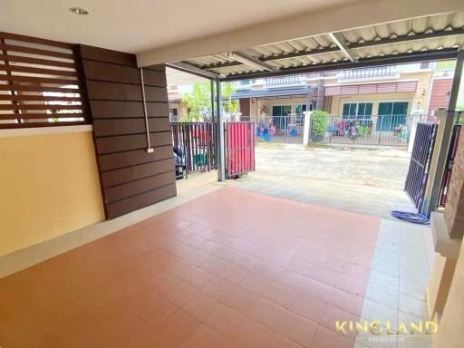 Covered carport with tiled floor