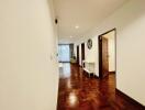 Hallway with wooden flooring and access to multiple rooms