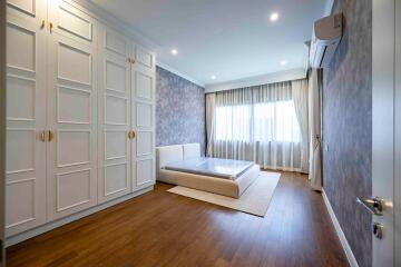 Spacious bedroom with built-in wardrobes