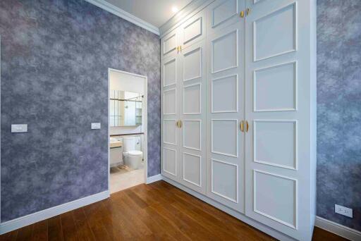 Bedroom with built-in wardrobe and adjoining bathroom