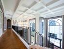 Elegant hallway with staircase and large windows