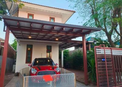 Two-story house with carport