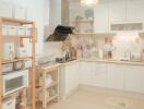 Well-organized kitchen with wooden shelves and white cabinets