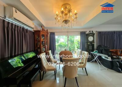 Elegant dining room with chandelier and large window