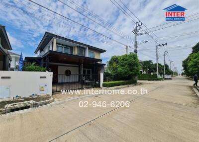 Front view of a modern detached house with driveway