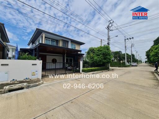 Front view of a modern detached house with driveway