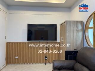 Living room with TV and wooden cabinet