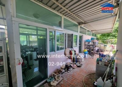 outdoor area with glass windows and a covered walkway