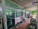 outdoor area with glass windows and a covered walkway