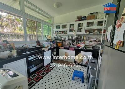 Spacious kitchen with modern appliances and ample storage