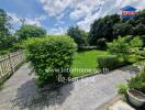 Beautiful garden with lush greenery and a paved walkway