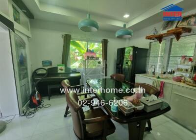 Dining room with table, chairs, and large windows