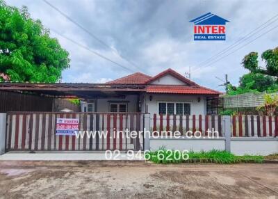 Front view of a house with a gated fence