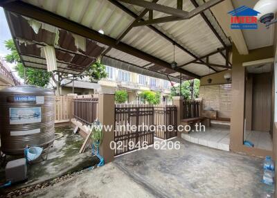 House exterior area with water tank and fenced space