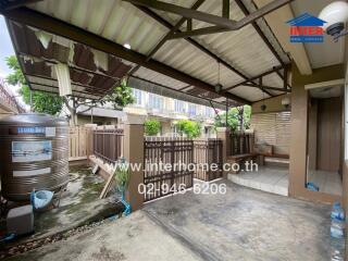 House exterior area with water tank and fenced space