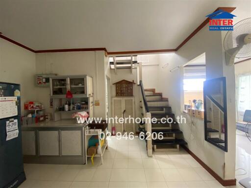 Kitchen and hallway with staircase