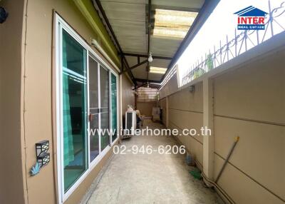 Covered outdoor walkway with sliding glass doors