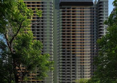 Exterior view of modern residential high-rise buildings with surrounding greenery