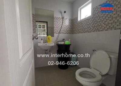 Compact bathroom with modern amenities