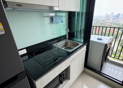 Modern kitchen with appliances and city view