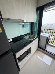 Modern kitchen with appliances and city view