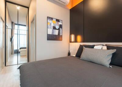 Modern bedroom with a large bed and minimalist design