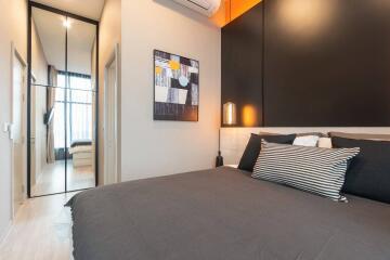 Modern bedroom with a large bed and minimalist design