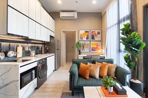 Modern living area with open kitchen and stylish decor