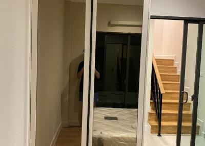 Bedroom with wardrobe and adjacent stairway