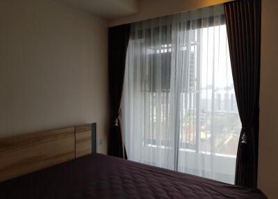 Bedroom with curtains and window view