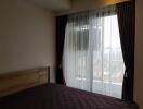 Bedroom with curtains and window view