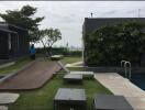 Rooftop swimming pool and lounge area with greenery and seating