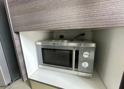 Built-in microwave oven in kitchen cabinet