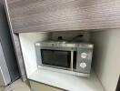 Built-in microwave oven in kitchen cabinet