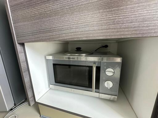 Built-in microwave oven in kitchen cabinet