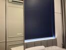 Bedroom with mirrored wardrobe and blue accent wall