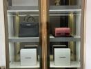 Glass cabinet with luxury items displayed