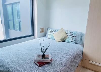 Cozy bedroom with a large window