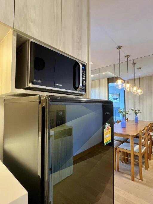 Modern kitchen with appliances and dining area