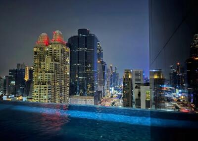 Balcony view of city skyline at night