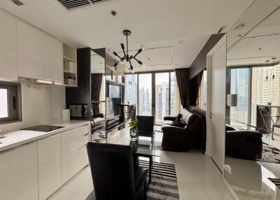 Modern open-plan living area with kitchen and city view