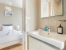 Bright bedroom with a modern ensuite bathroom