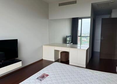 Modern bedroom with large window and vanity desk