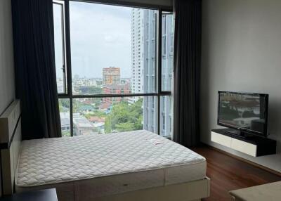 Modern bedroom with large window