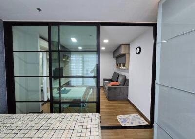 Modern living space with a sliding glass partition