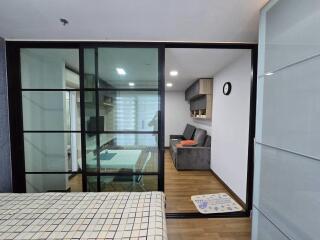 Modern living space with a sliding glass partition