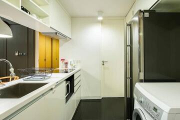 Modern kitchen with white cabinetry and appliances