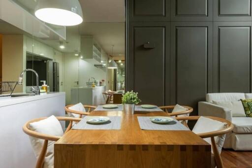 Modern dining area with wooden table and chairs