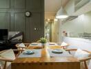 Modern dining area with wooden table, chairs, and decorative features