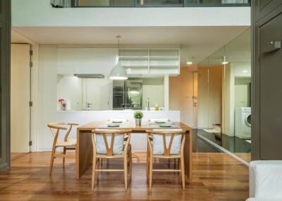 Modern kitchen and dining area with wooden furniture